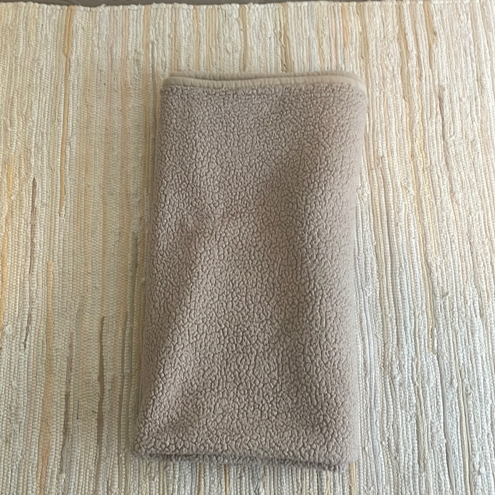 Large throw blanket. Tan color. About 5 ft by 5 ft.